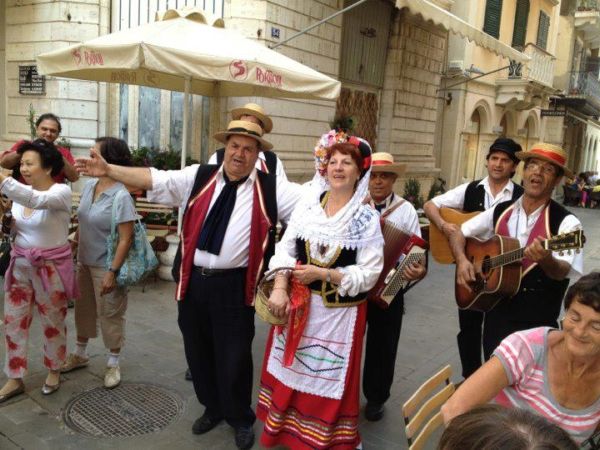 Corfu dancers and organ players in traditional costumes